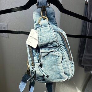 Free People Crossbody Bag. NWT. Material made out of denim.